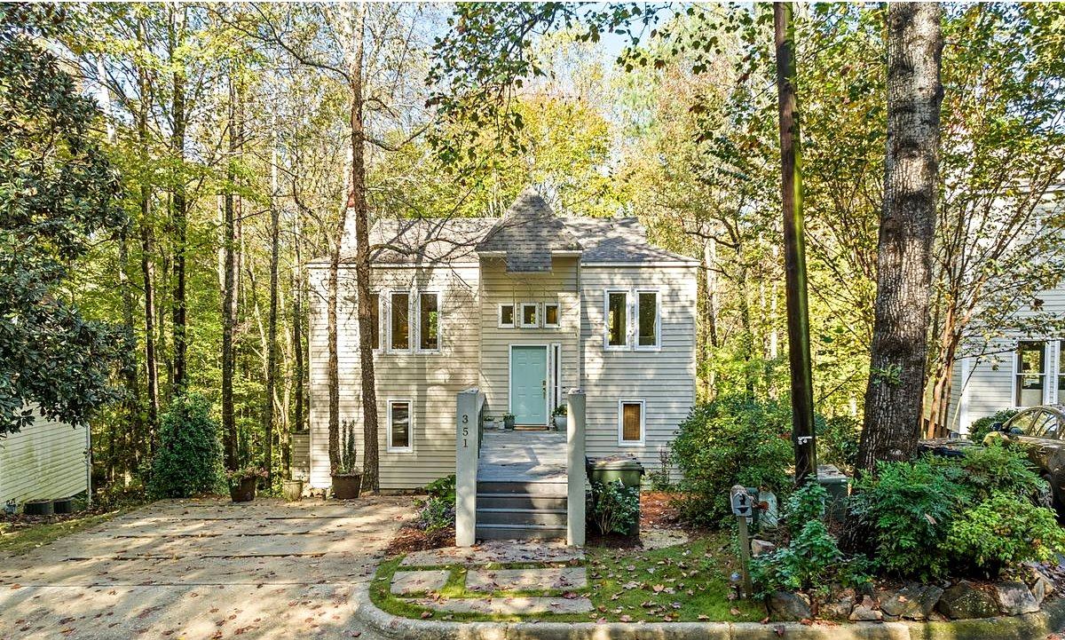 Clean white rental home with a porch