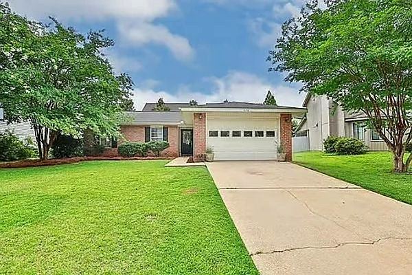 Rental home with a front entry and landscaping